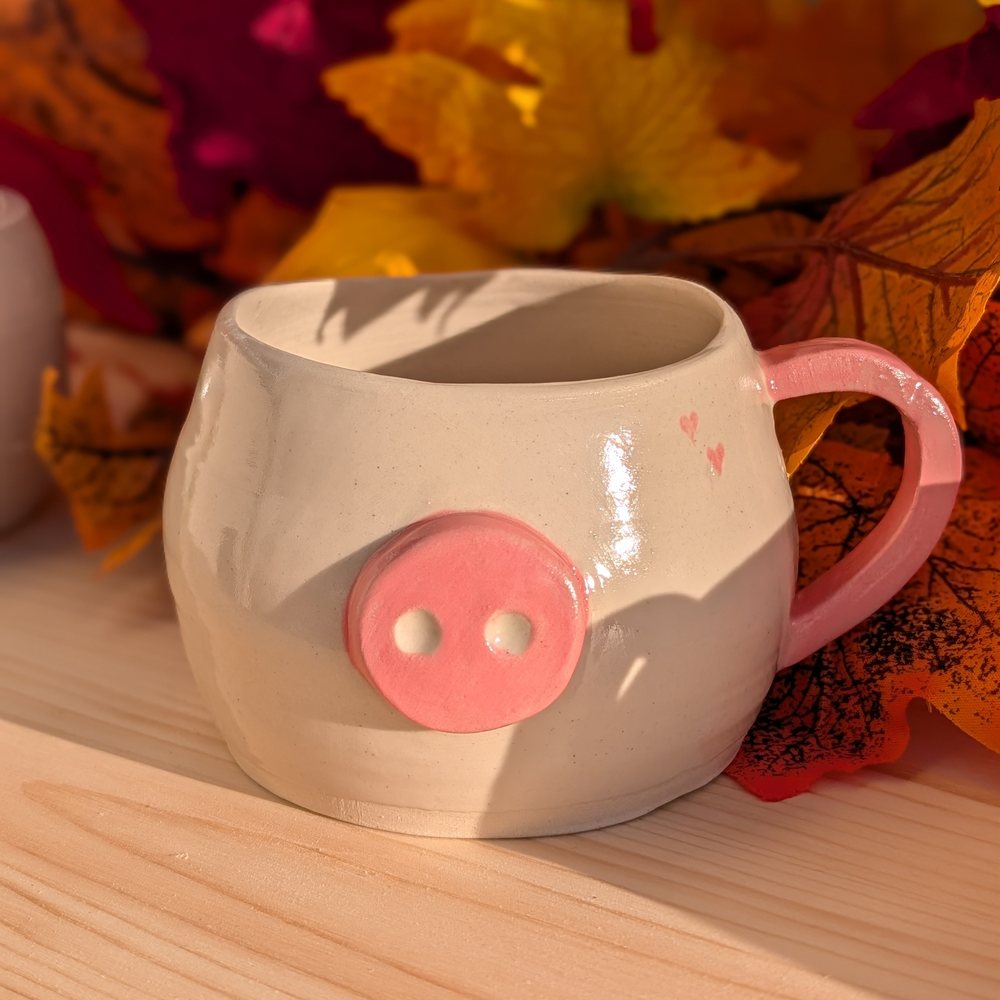 Handled mug with a pink button snout, little hearts and a pink handle